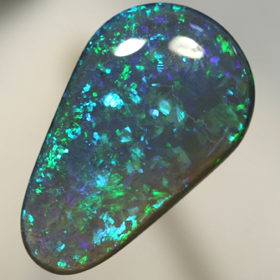 SOLID BLACK OPAL Huge, top quality. With Green and turquoise endlessly sparkling. SEE VIDEO